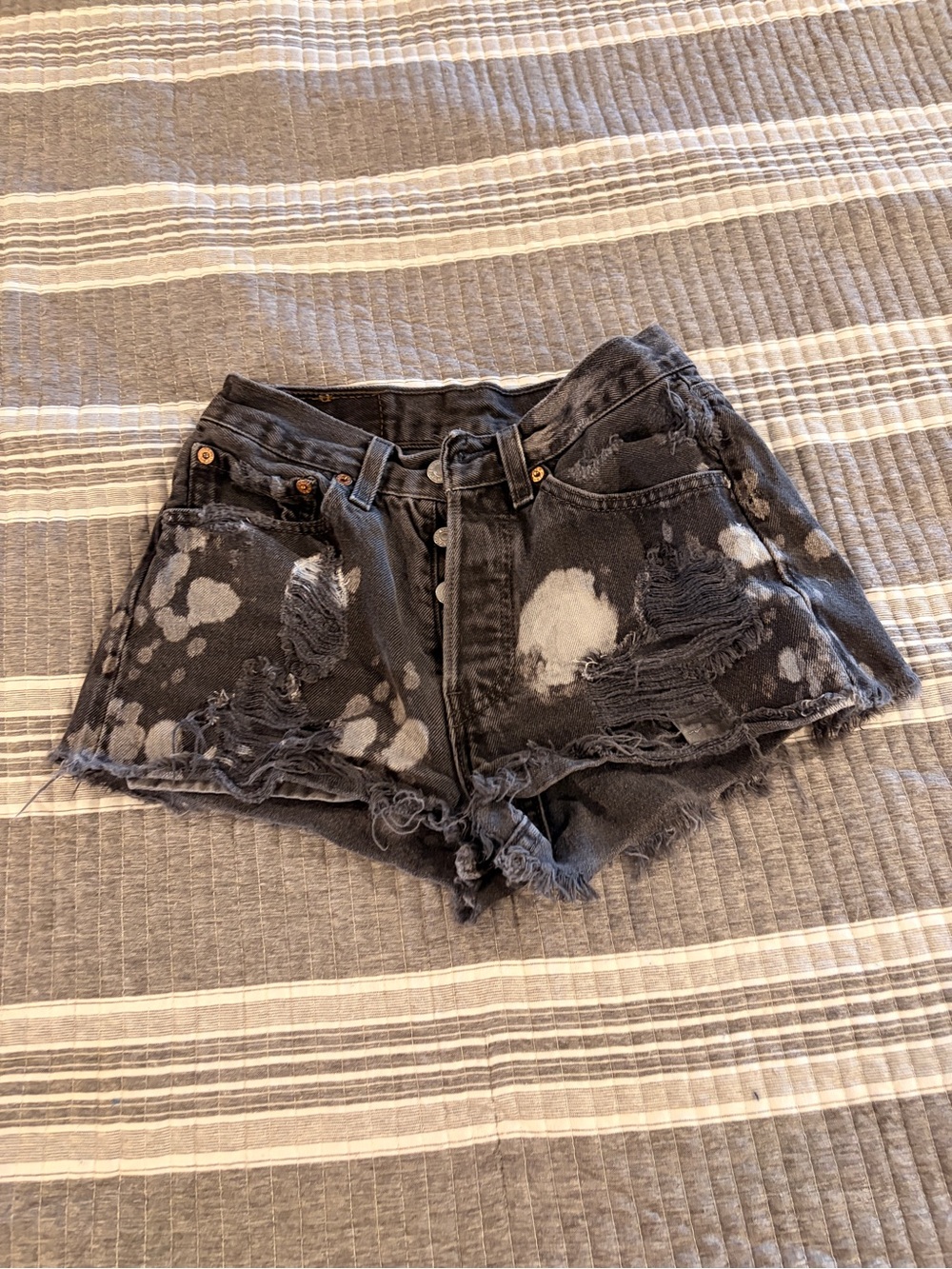 Levi’s Women’s 26” Distressed Black Bleach-Spot Denim Shorts